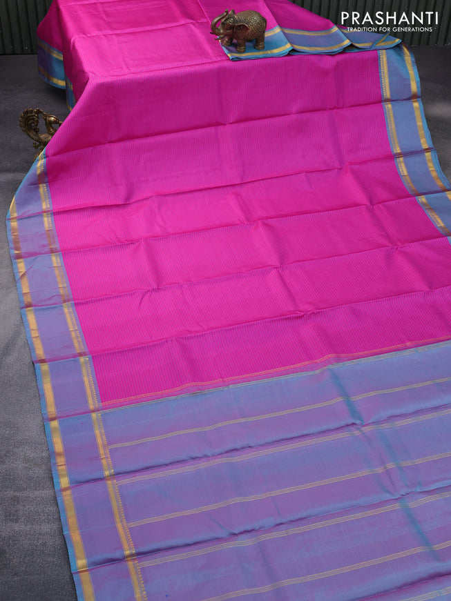 Pure kanchipuram silk saree pink and dual shade of teal blue with allover stripes pattern and rettapet zari woven border