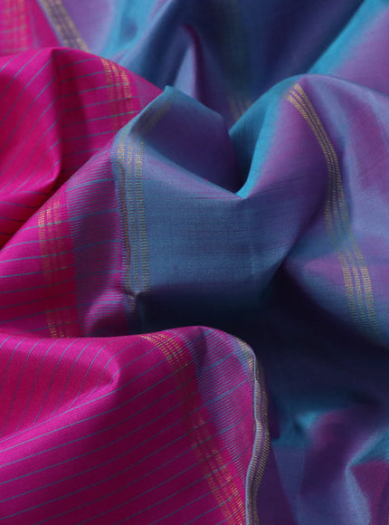 Pure kanchipuram silk saree pink and dual shade of teal blue with allover stripes pattern and rettapet zari woven border