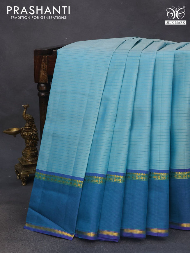 Pure kanchipuram silk saree teal blue and violet with allover stripes pattern and rettapet zari woven border