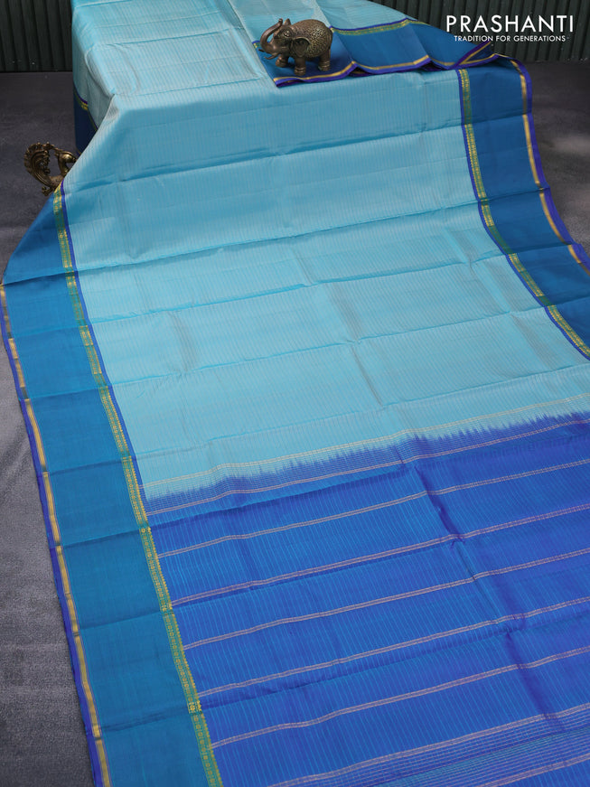 Pure kanchipuram silk saree teal blue and violet with allover stripes pattern and rettapet zari woven border