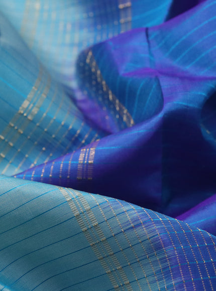 Pure kanchipuram silk saree teal blue and violet with allover stripes pattern and rettapet zari woven border