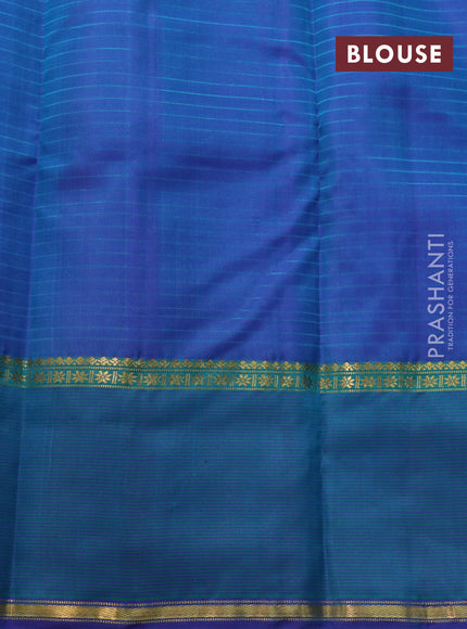 Pure kanchipuram silk saree teal blue and violet with allover stripes pattern and rettapet zari woven border