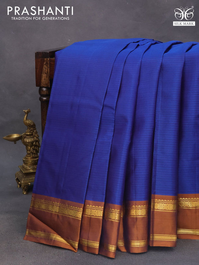 Pure kanchipuram silk saree blue and dark mustard with allover stripes pattern and rettapet zari woven border