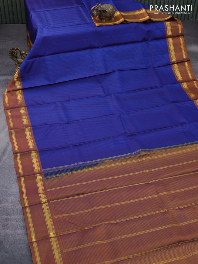 Pure kanchipuram silk saree blue and dark mustard with allover stripes pattern and rettapet zari woven border