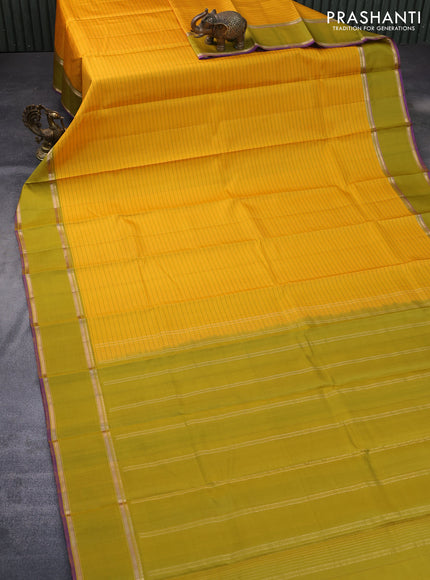 Pure kanchipuram silk saree mango yellow and violet with allover stripes pattern and rettapet zari woven border