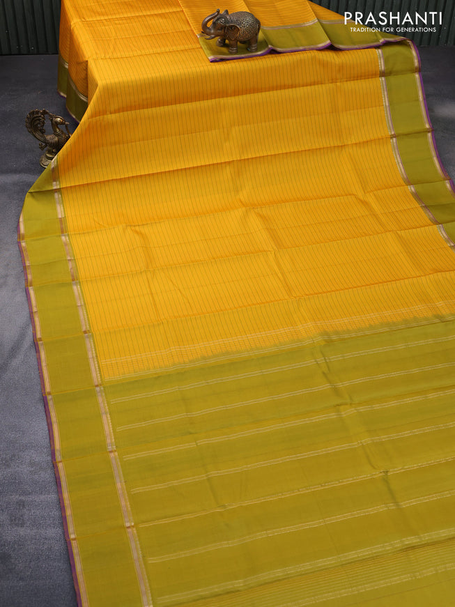 Pure kanchipuram silk saree mango yellow and violet with allover stripes pattern and rettapet zari woven border