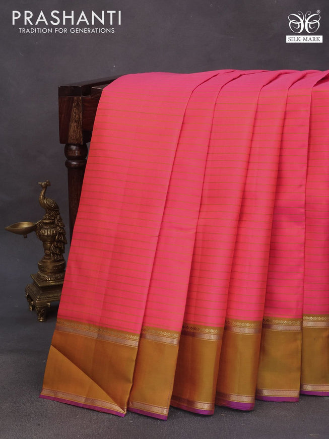 Pure kanchipuram silk saree dual shade of pinkish orange and violet with allover stripes pattern and rettapet zari woven border