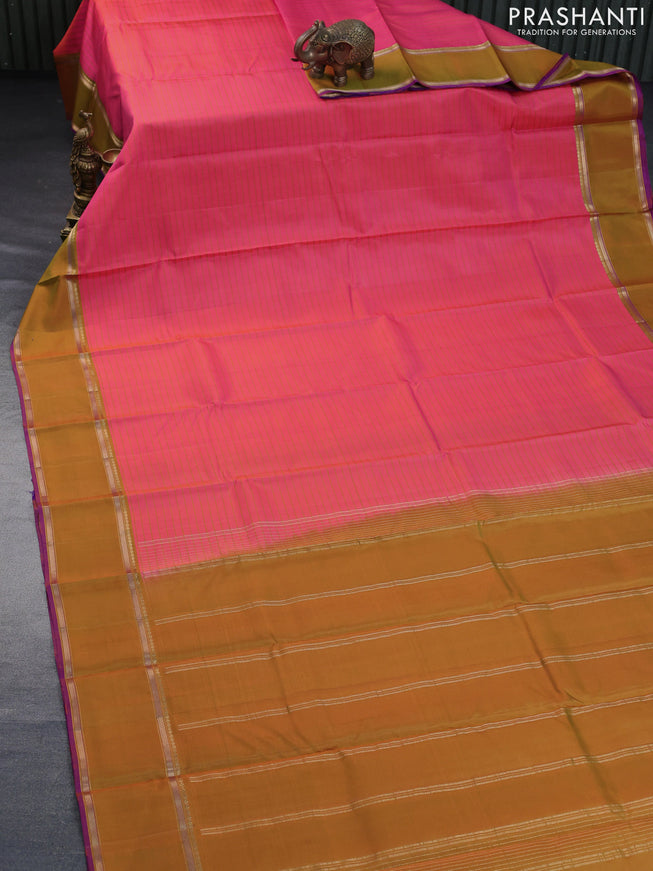 Pure kanchipuram silk saree dual shade of pinkish orange and violet with allover stripes pattern and rettapet zari woven border