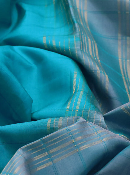 Pure kanchipuram silk saree teal blue and grey with allover stripes pattern and rettapet zari woven border