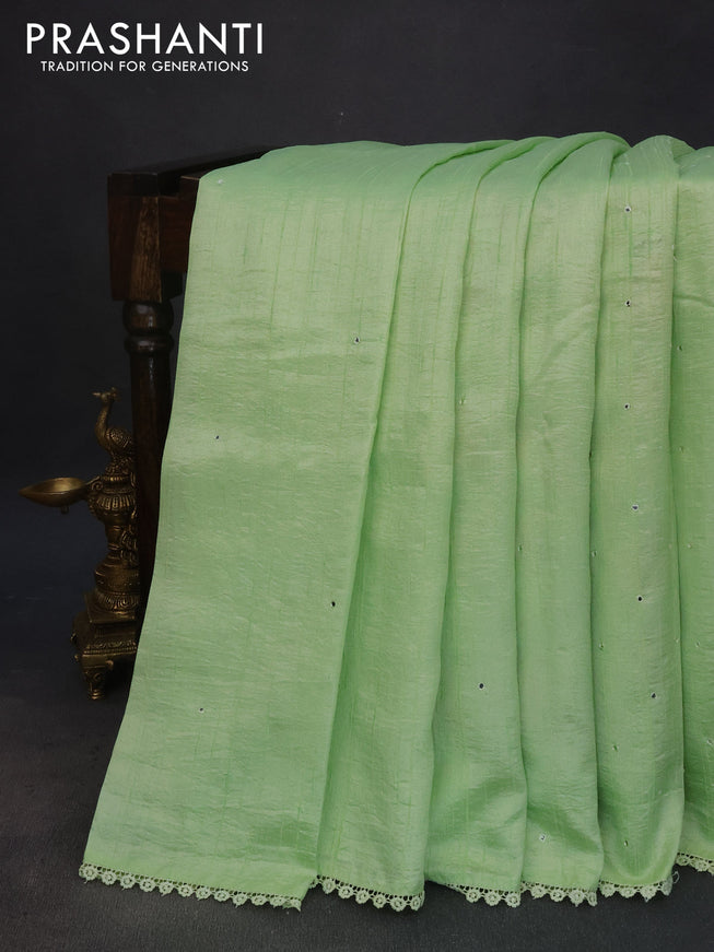 Semi raw silk saree pista green with allover mirror work and lace work border