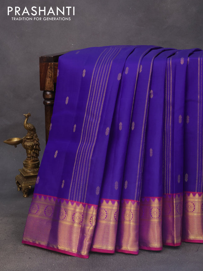 Pure kanchipuram silk saree blue and dual shade of magenta pink with allover zari strips & buttas and rich zari woven border