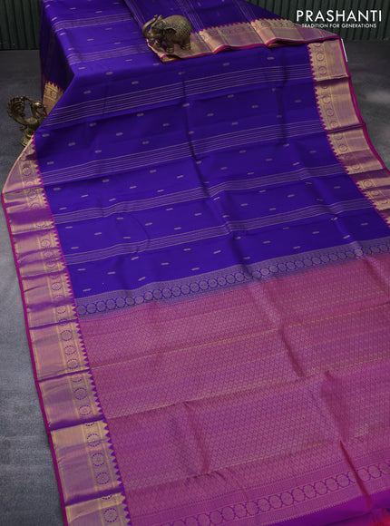 Pure kanchipuram silk saree blue and dual shade of magenta pink with allover zari strips & buttas and rich zari woven border