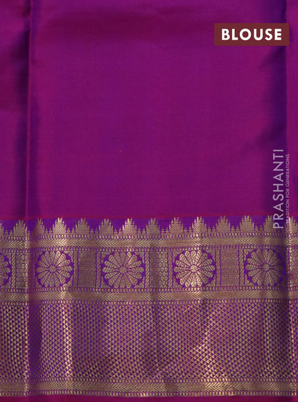 Pure kanchipuram silk saree blue and dual shade of magenta pink with allover zari strips & buttas and rich zari woven border