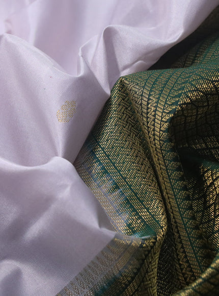 Pure kanchipuram silk saree pastel grey and dark green with zari woven buttas and rich zari woven korvai border