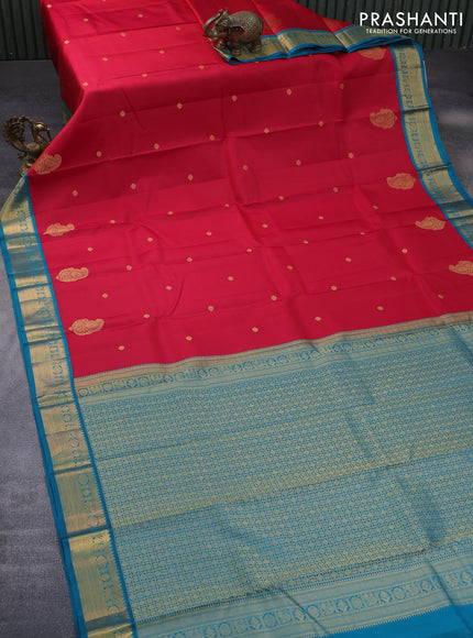 Pure kanchipuram silk saree reddish pink and peacock blue with zari woven buttas and rich zari woven korvai border