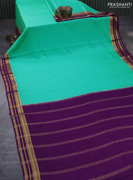 Pure mysore silk saree teal blue and purple with plain body and rich zari woven border