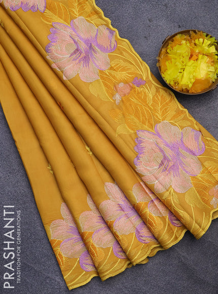 Semi raw silk saree mustard yellow with embroidery work buttas and floral design embroidery work border