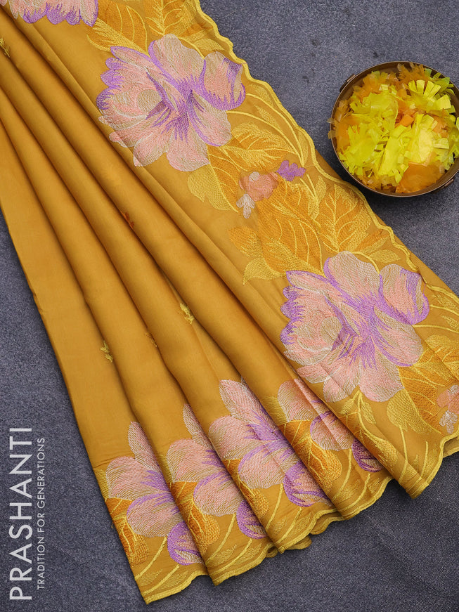 Semi raw silk saree mustard yellow with embroidery work buttas and floral design embroidery work border