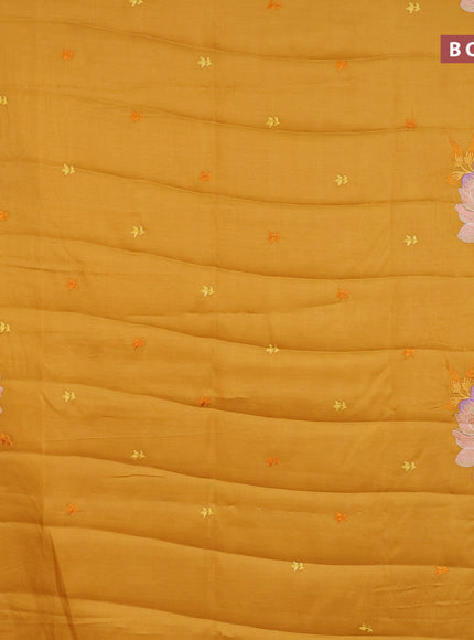 Semi raw silk saree mustard yellow with embroidery work buttas and floral design embroidery work border