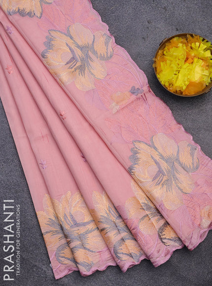 Semi raw silk saree peach shade with embroidery work buttas and floral design embroidery work border