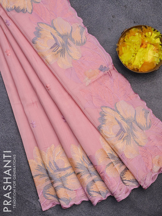 Semi raw silk saree peach shade with embroidery work buttas and floral design embroidery work border