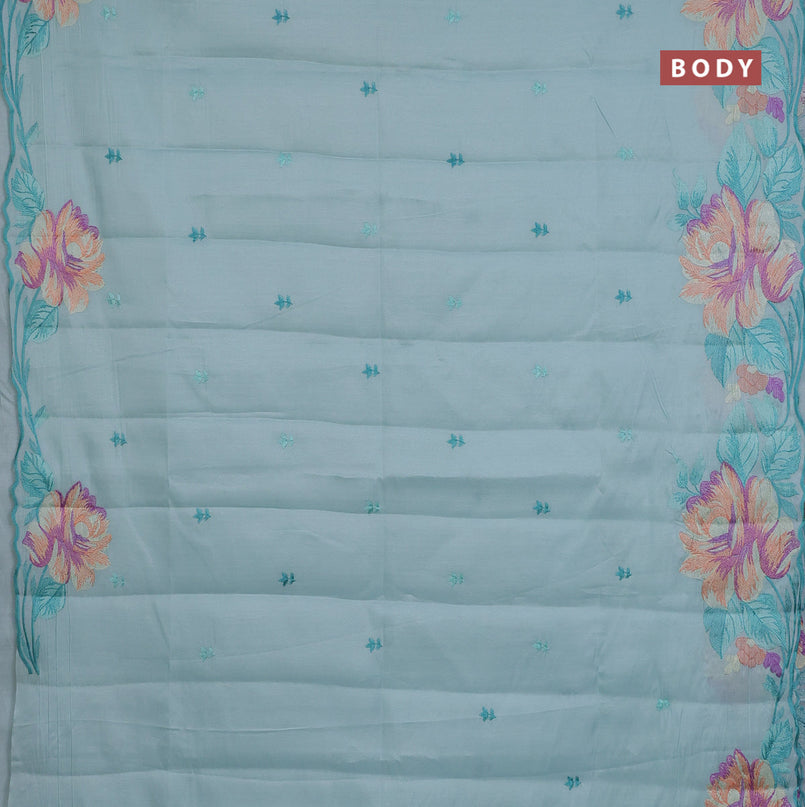 Semi raw silk saree teal blue shade with embroidery work buttas and floral design embroidery work border