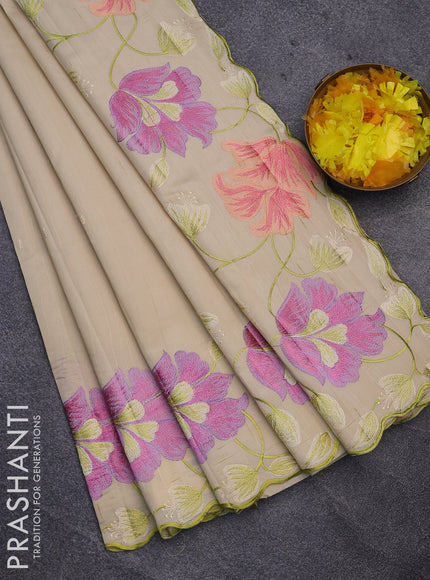 Semi raw silk saree cream with embroidery work buttas and floral design embroidery work border