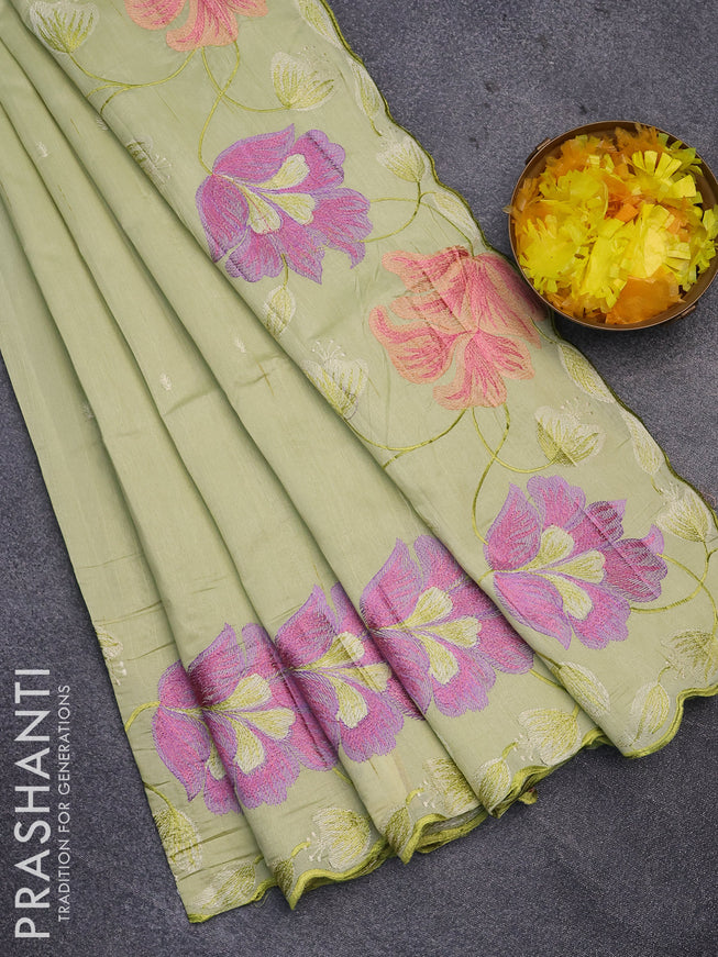 Semi raw silk saree mild pista green with embroidery work buttas and floral design embroidery work border