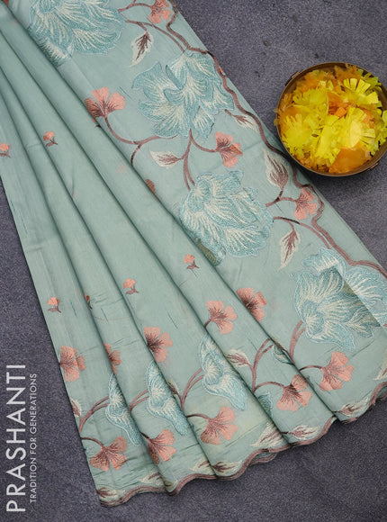 Semi raw silk saree pastel green shade with embroidery work buttas and floral design embroidery work border