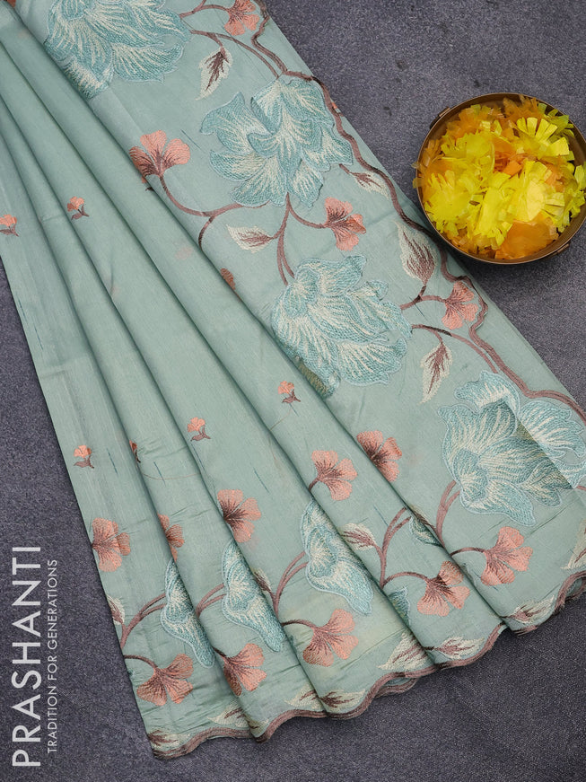 Semi raw silk saree pastel green shade with embroidery work buttas and floral design embroidery work border