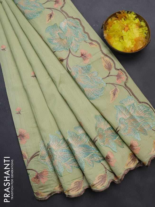 Semi raw silk saree mild pista green with embroidery work buttas and floral design embroidery work border