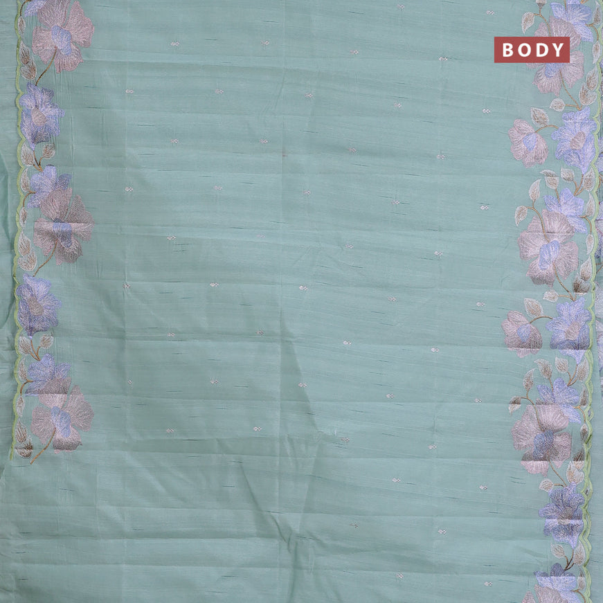 Semi raw silk saree pastel green shade with embroidery work buttas and floral design embroidery work border