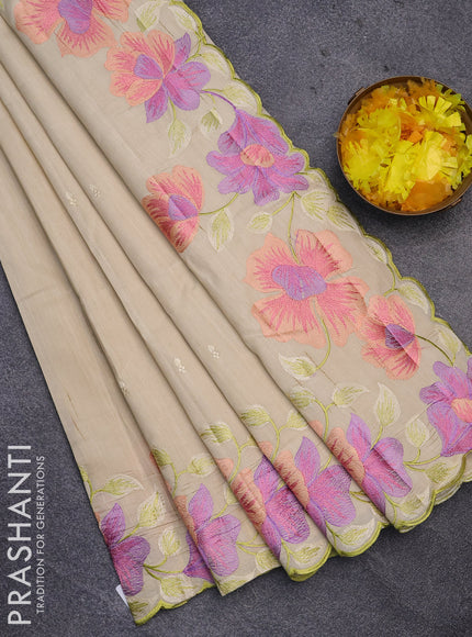 Semi raw silk saree cream with embroidery work buttas and floral design embroidery work border