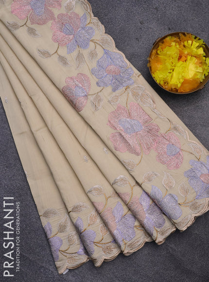 Semi raw silk saree cream with embroidery work buttas and floral design embroidery work border