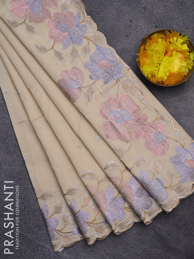 Semi raw silk saree cream with embroidery work buttas and floral design embroidery work border