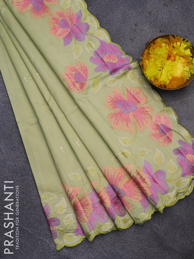 Semi raw silk saree pista green with embroidery work buttas and floral design embroidery work border