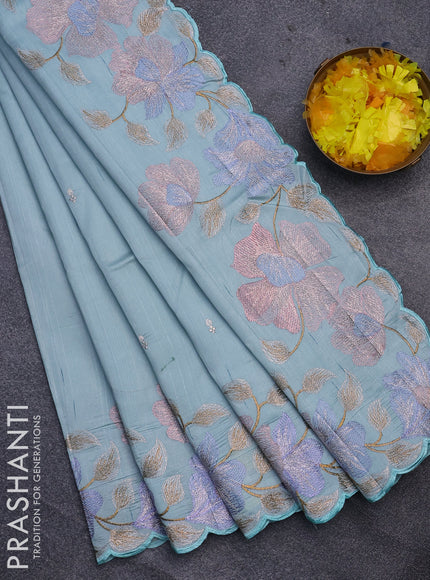 Semi raw silk saree teal blue shade with embroidery work buttas and floral design embroidery work border