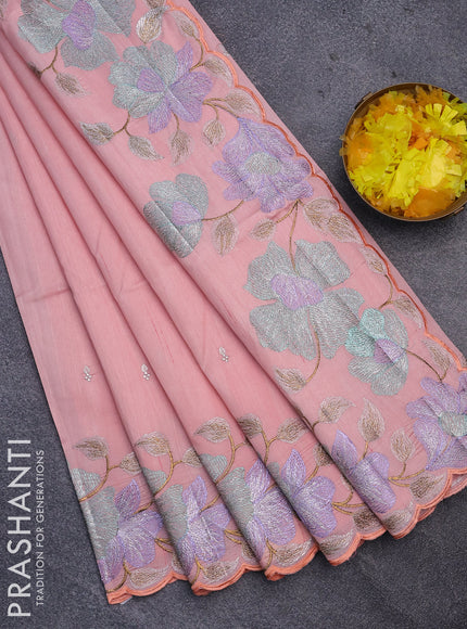 Semi raw silk saree peach shade with embroidery work buttas and floral design embroidery work border