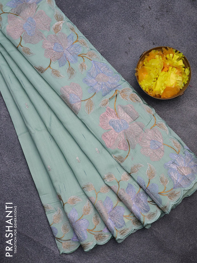 Semi raw silk saree pastel green shade with embroidery work buttas and floral design embroidery work border