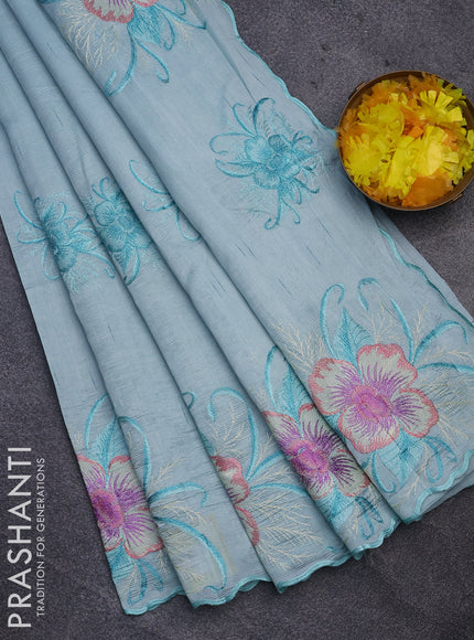 Semi raw silk saree teal blue shade with embroidery work buttas and floral design embroidery work butta border