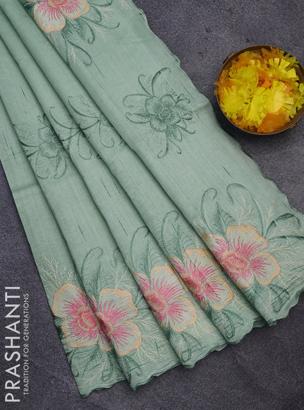 Semi raw silk saree teal green shade with embroidery work buttas and floral design embroidery work butta border