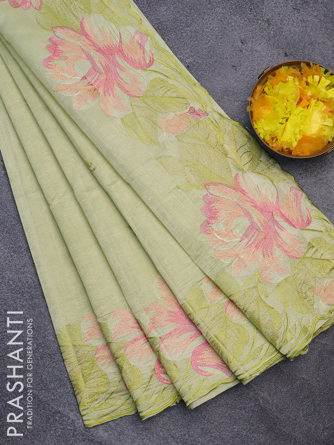 Semi raw silk saree pista green with embroidery work buttas and floral design embroidery work butta border