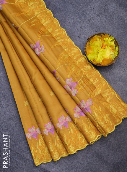 Semi raw silk saree mustard yellow with embroidery work buttas and floral design embroidery work border