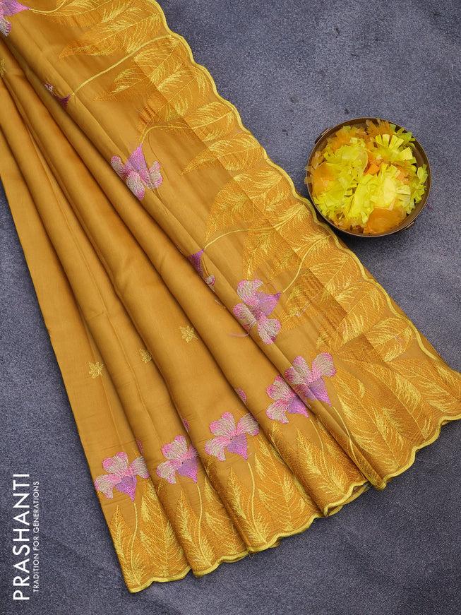 Semi raw silk saree mustard yellow with embroidery work buttas and floral design embroidery work border