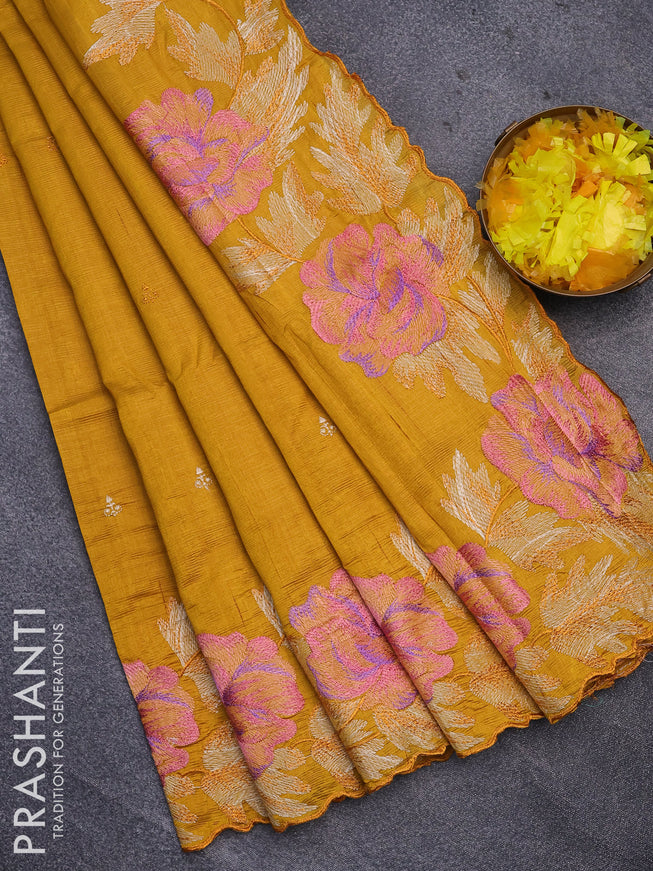 Semi raw silk saree mustard yellow with embroidery work buttas and floral design embroidery work border