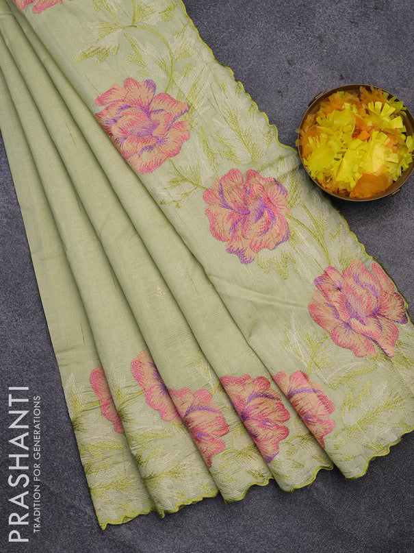 Semi raw silk saree pista green with embroidery work buttas and floral design embroidery work border