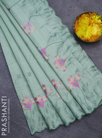 Semi raw silk saree pastel green with embroidery work buttas and floral design embroidery work border