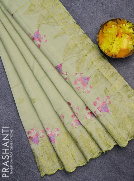 Semi raw silk saree mild pista green with embroidery work buttas and floral design embroidery work border