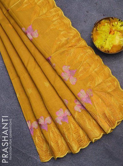 Semi raw silk saree mustard yellow with embroidery work buttas and floral design embroidery work border