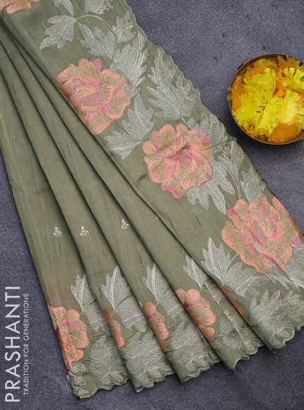 Semi raw silk saree pastel green shade with embroidery work buttas and floral design embroidery work border